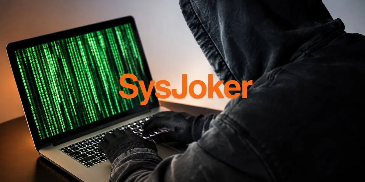 Persona frente a un portátil con el texto SysJoker